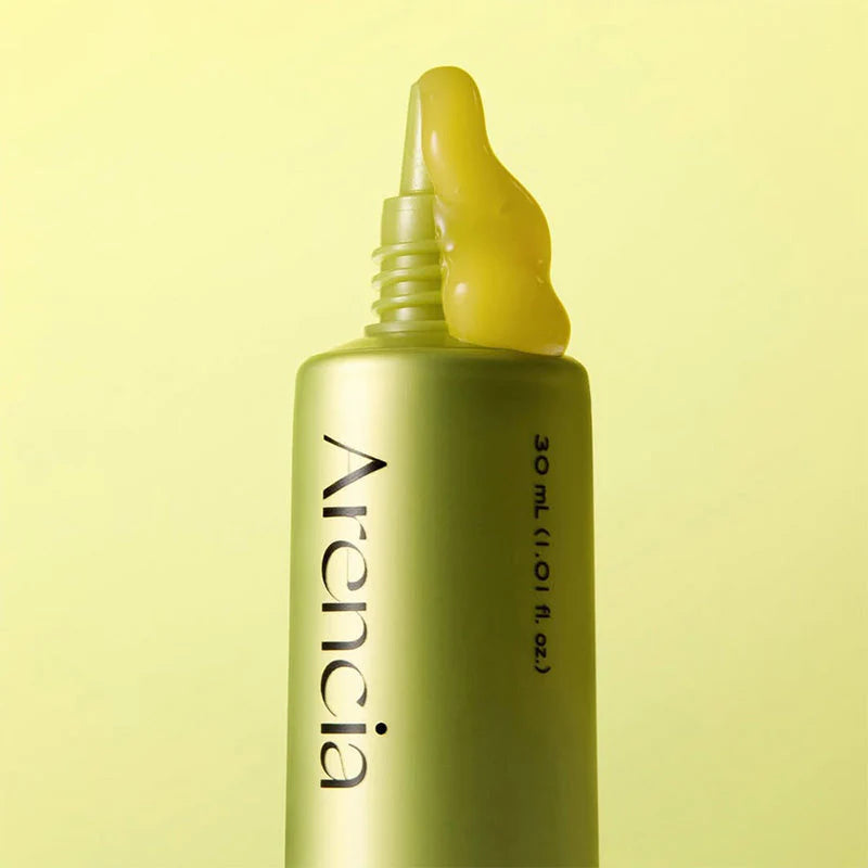 Arencia Vitamin C Booster Shot serum in a small bottle, designed to brighten skin and reduce post-blemish marks.